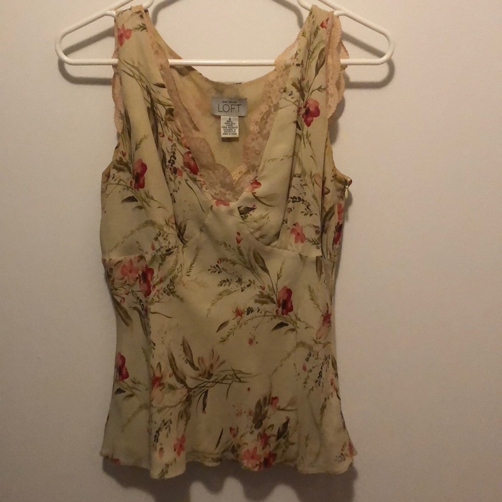 Tan dressy tank with floral design.